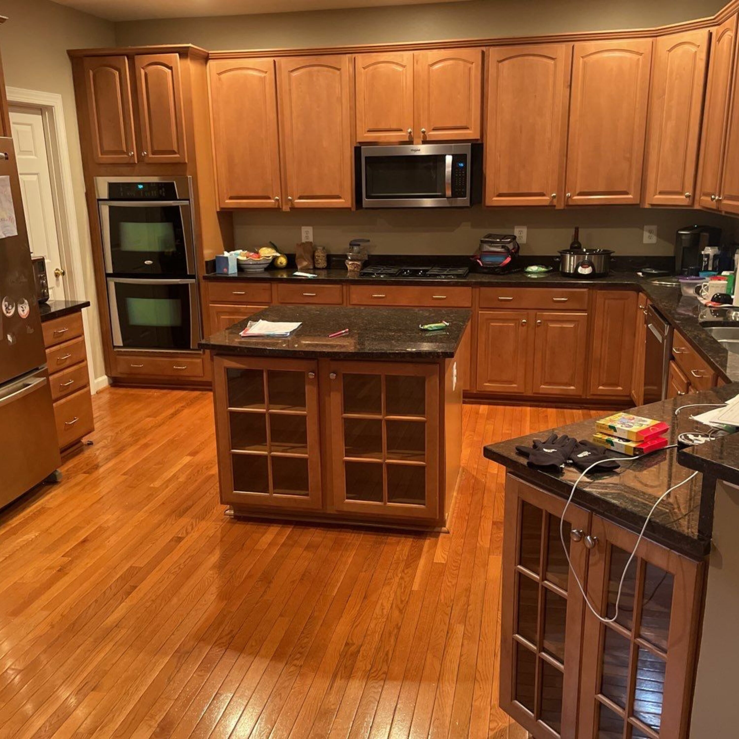 Glass-front island with dark granite top