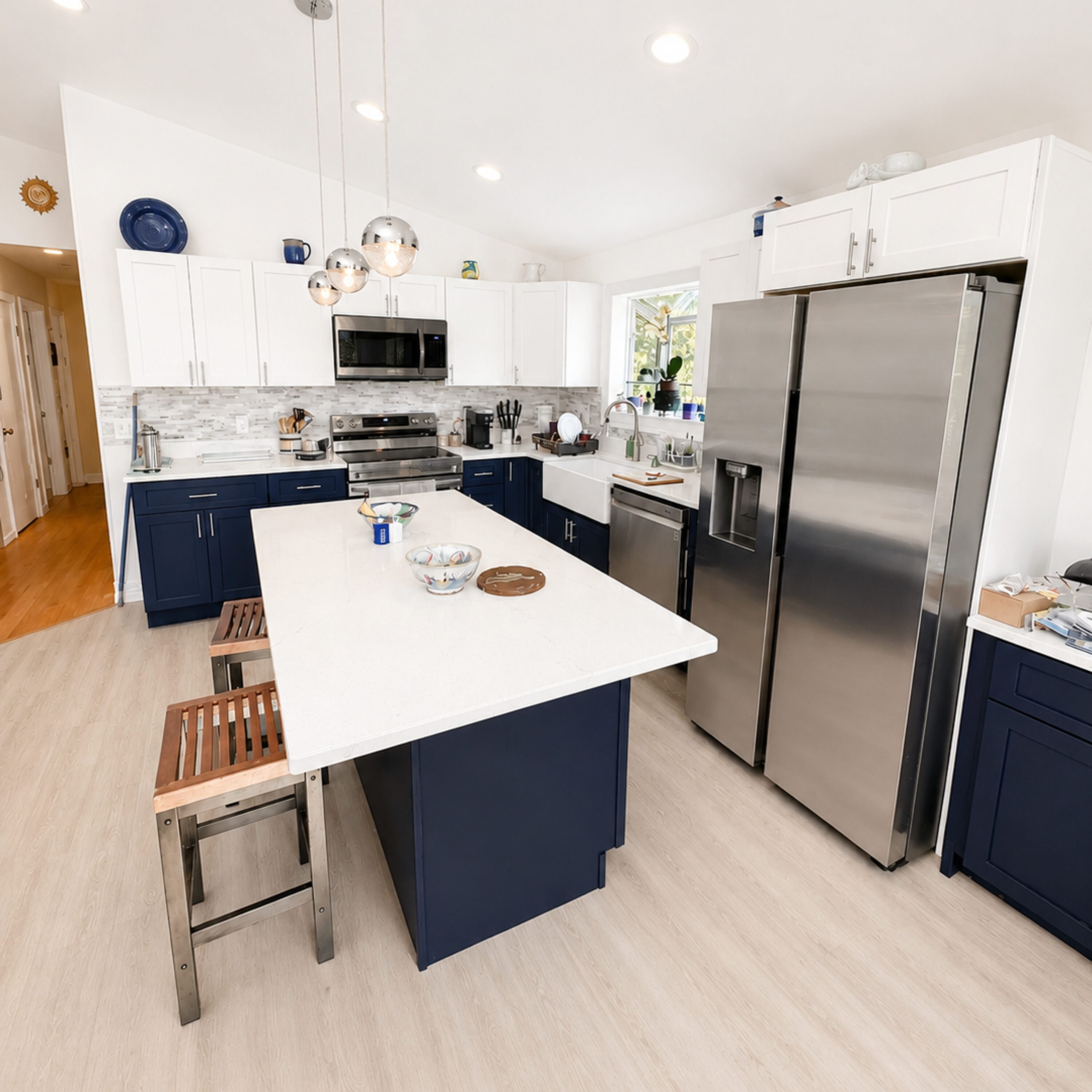 Modern navy and white kitchen island with stools