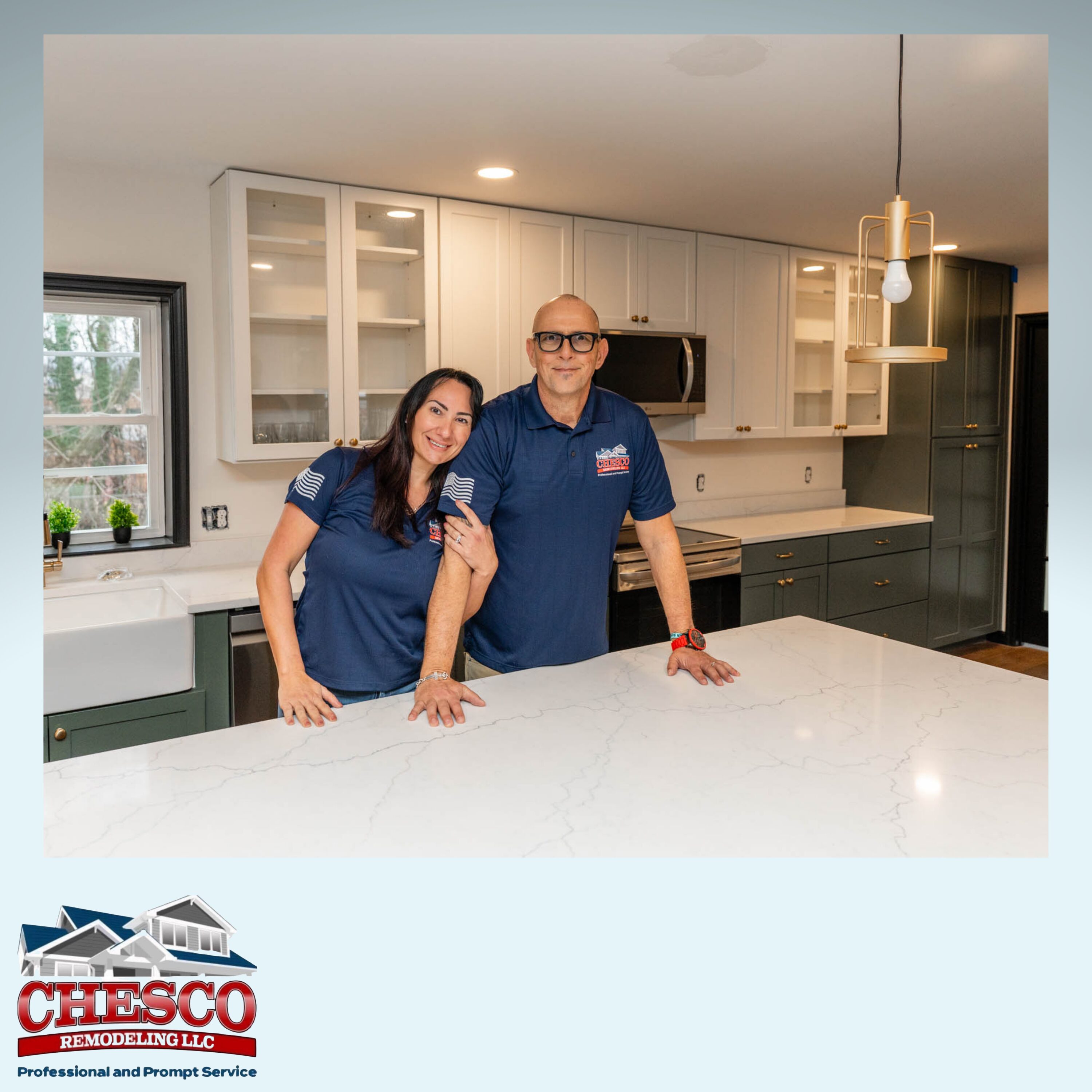 Two remodelers smiling in modern kitchen