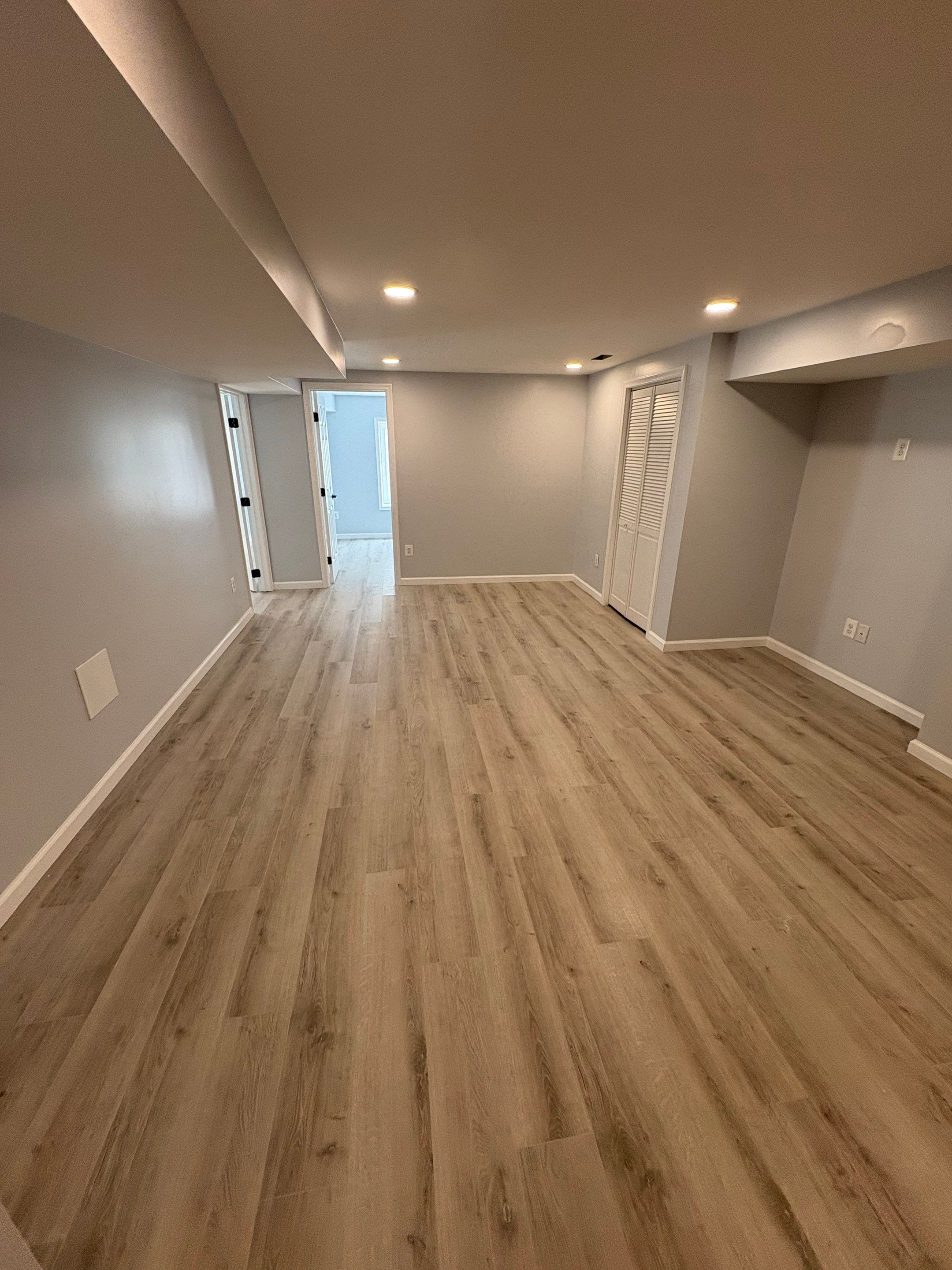 Basement room with recessed ceiling lights