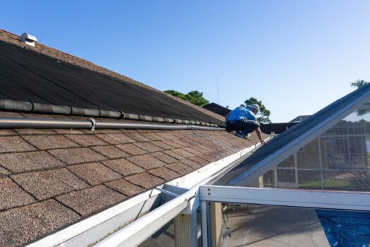 Roofing contractor inspecting roof